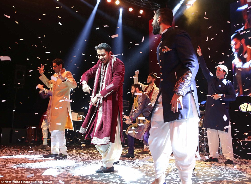 The groom, Rohan Mehta, centre, showed off his dancing prowess taking to the stage during an energetic number