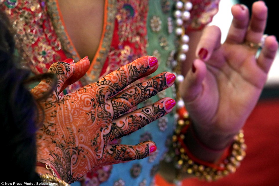 Many of the women at the wedding wore traditional Indian dress and also decorated their hands with traditional henna tattoos