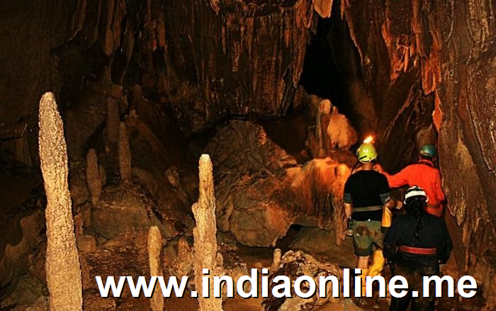 Tourists exploring cave in Meghalaya